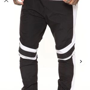 Fashion Nova color-block track pants, Size Large. primarily black NWOT